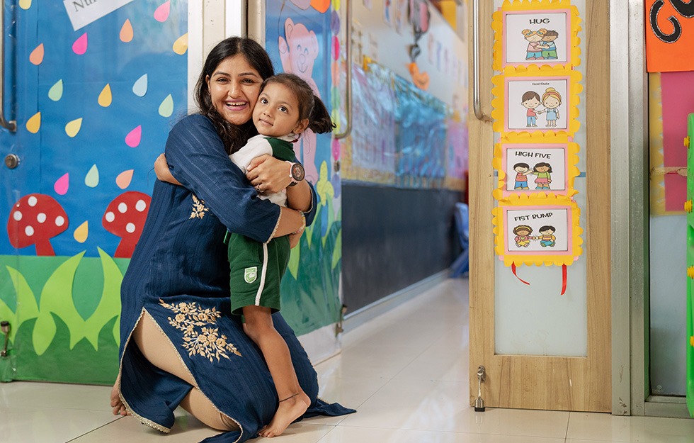 Student & Teacher Hugging